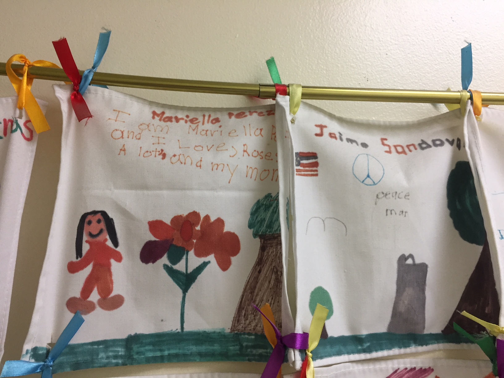 Posters from immigrant children shown at the Chicago office of World Relief